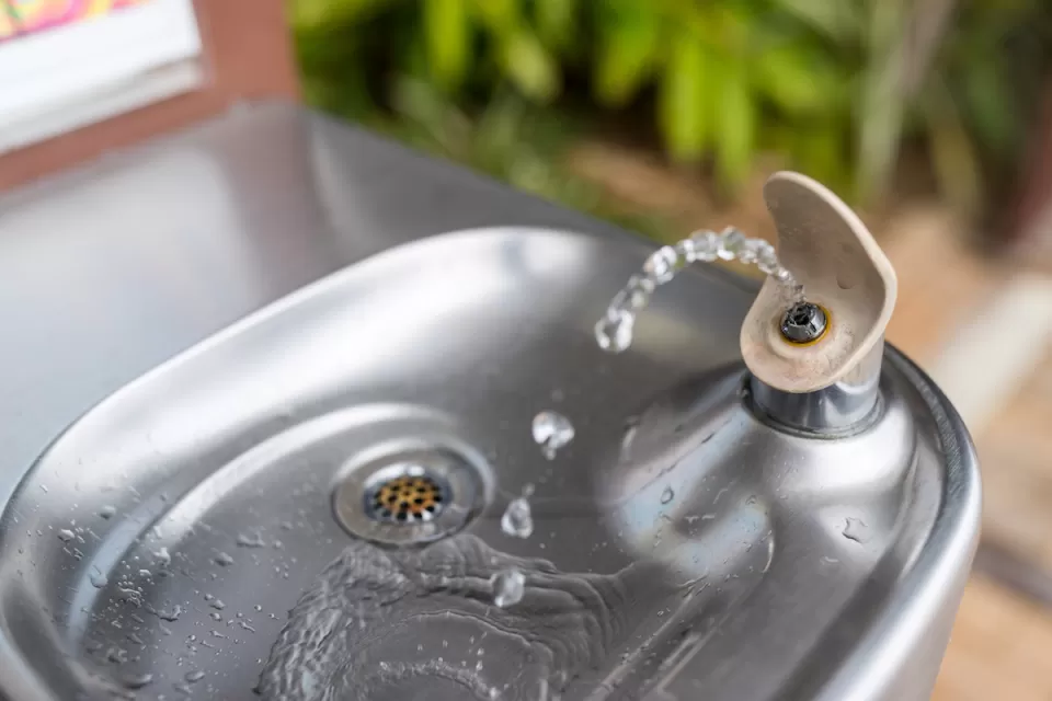 Close-up of silver modern drinking fountain.
